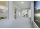 Covered lanai with tile flooring and multiple entrances at 560 Viceroy Ct, Kissimmee, FL 34758