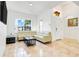 Bright and spacious living room with neutral paint, tile flooring, and plenty of natural light at 560 Viceroy Ct, Kissimmee, FL 34758