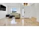 Bright living room featuring neutral paint, tile flooring, and plenty of natural light at 560 Viceroy Ct, Kissimmee, FL 34758