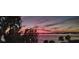 Stunning sunset view over the lake, showcasing vibrant colors and a tranquil setting at 629 Helen St, Mount Dora, FL 32757
