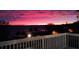 Breathtaking sunset over the water, captured from a balcony with a charming neighborhood view at 629 Helen St, Mount Dora, FL 32757
