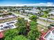 Aerial view of apartment complex with parking, greenery, and street at 744 Wyman Ct # 744, Orlando, FL 32809