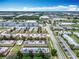Wide aerial view showcasing apartment buildings, surrounding roads and businesses at 744 Wyman Ct # 744, Orlando, FL 32809