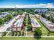 Aerial view of apartment complex with mature trees and parking spaces at 744 Wyman Ct # 744, Orlando, FL 32809
