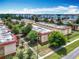 Aerial view of apartment complex with trees, parking, and surrounding buildings at 744 Wyman Ct # 744, Orlando, FL 32809