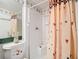 Bathroom featuring vanity sink, shower, and toilet with patterned details at 744 Wyman Ct # 744, Orlando, FL 32809