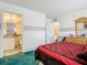 View of bedroom with ensuite bathroom and dresser at 744 Wyman Ct # 744, Orlando, FL 32809