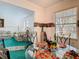 Dining area featuring a glass table with patterned linens and views into living room at 744 Wyman Ct # 744, Orlando, FL 32809