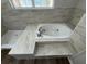 Close-up of a soaking tub and a glass enclosed shower at 7507 Sandstone Dr, Orlando, FL 32836