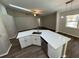 Bright kitchen featuring white cabinets, stainless steel appliances, and modern countertops under a vaulted ceiling at 7507 Sandstone Dr, Orlando, FL 32836