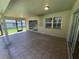 Covered patio with tiled flooring, offering a relaxing outdoor living space at 7507 Sandstone Dr, Orlando, FL 32836
