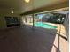 Spacious covered patio with views of the backyard pool and screened enclosure at 7507 Sandstone Dr, Orlando, FL 32836