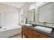 Beautiful bathroom with double vanity, soaking tub, and modern fixtures at 7551 Bear Claw Run, Orlando, FL 32825