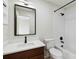 Bathroom boasts a shower-tub combination and modern fixtures for a sleek and comfortable experience at 7551 Bear Claw Run, Orlando, FL 32825