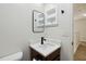 Bathroom features modern fixtures, a well-lit mirror, and a clean design at 7551 Bear Claw Run, Orlando, FL 32825