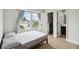 Bedroom featuring hardwood floors, access to closet and bathroom, and lots of natural light at 7551 Bear Claw Run, Orlando, FL 32825
