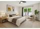 Bright bedroom featuring a ceiling fan, large window and neutral colors for a calm and relaxing atmosphere at 7551 Bear Claw Run, Orlando, FL 32825