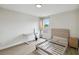 Bright bedroom featuring wood-look floors, a desk, and a window for lots of natural light at 7551 Bear Claw Run, Orlando, FL 32825