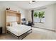 Cozy bedroom features a murphy bed, desk area, and ample natural light at 7551 Bear Claw Run, Orlando, FL 32825