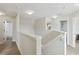 Upstairs hallway with views into the bathrooms at 7551 Bear Claw Run, Orlando, FL 32825