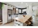 Stylish kitchen featuring a wood island, stainless steel appliances and white cabinetry at 7551 Bear Claw Run, Orlando, FL 32825