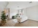 Bright and airy living room featuring modern furniture, wood-look floors, and natural light at 7551 Bear Claw Run, Orlando, FL 32825