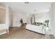 Open-concept living room featuring modern décor, wood-look floors, and ample space for entertaining at 7551 Bear Claw Run, Orlando, FL 32825
