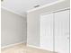 Cozy bedroom with a closet featuring neutral carpet at 7710 Linkside Loop, Reunion, FL 34747