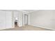 Bedroom featuring neutral carpet, fresh paint, with closet and doorway at 7710 Linkside Loop, Reunion, FL 34747