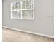 Bedroom featuring neutral carpet and window at 7710 Linkside Loop, Reunion, FL 34747