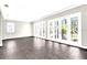 Spacious living area features multiple French doors and tile flooring, offering ample natural light at 7710 Linkside Loop, Reunion, FL 34747