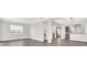 Open-concept living space offering seamless flow between living, dining, and kitchen areas at 7710 Linkside Loop, Reunion, FL 34747