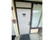 Condo entrance showing door with unit number and a window at 7900 S Orange Blossom Trail # 2041, Orlando, FL 32809
