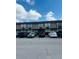 Exterior of building with two stories of rooms, parking, and landscaping at 7900 S Orange Blossom Trail # 2041, Orlando, FL 32809