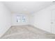 Bright bedroom with large windows and carpeted floors at 809 Benoi Dr, Davenport, FL 33896