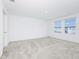 Spacious bedroom features carpeted floors and bright natural light at 809 Benoi Dr, Davenport, FL 33896