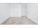 A bright room with two doors and neutral carpet at 809 Benoi Dr, Davenport, FL 33896