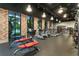 Well-equipped fitness center with treadmills and weight benches, accented by brick walls and ample natural light at 809 Benoi Dr, Davenport, FL 33896