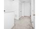Hallway features white walls and carpeted floors with neutral colors at 809 Benoi Dr, Davenport, FL 33896