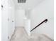 Bright hallway features white walls and carpeted floors at 809 Benoi Dr, Davenport, FL 33896