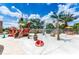 Fun community splash pad area with pirate ship water features and comfortable seating for families to enjoy at 809 Benoi Dr, Davenport, FL 33896