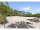 Outdoor sand volleyball court providing ample space for recreational activities and community fun at 809 Benoi Dr, Davenport, FL 33896