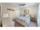Cozy bedroom with ceiling fan, soft lighting, and closet, offering a serene retreat at 821 Shallow Brook Ave, Winter Springs, FL 32708