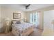 Inviting bedroom with soft lighting, a ceiling fan, and serene ambiance, providing a comfortable space at 821 Shallow Brook Ave, Winter Springs, FL 32708