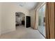 The bonus room features neutral carpeting, an arched entryway, and sliding glass doors to the outdoor area at 821 Shallow Brook Ave, Winter Springs, FL 32708