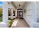 Charming front entrance with double doors, brick floor and decorative wreath at 821 Shallow Brook Ave, Winter Springs, FL 32708