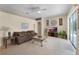 Cozy living area featuring tile flooring, comfortable seating, and a sliding glass door to the outdoor area at 821 Shallow Brook Ave, Winter Springs, FL 32708