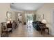Spacious living area with tile flooring, comfortable seating, and seamless access to the outdoor pool area at 821 Shallow Brook Ave, Winter Springs, FL 32708