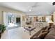 Inviting living space with tile floors, a seamless indoor-outdoor flow, and a view of the pool area at 821 Shallow Brook Ave, Winter Springs, FL 32708