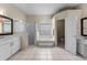Spacious main bathroom with double vanity, tub and walk-in shower at 821 Shallow Brook Ave, Winter Springs, FL 32708